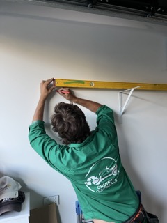 Helping with the extras - shelving install for a regular client